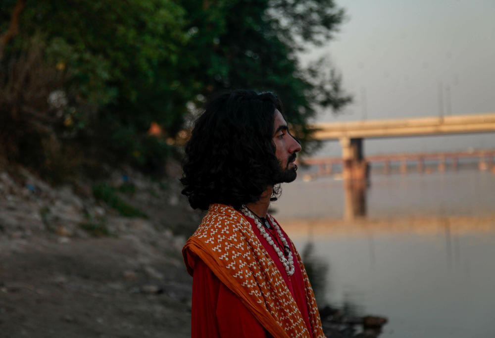 Abuzar Madhu, an environmentalist, on the banks of the Ravi River as it crosses the Pakistani city of Lahore. He has been trying to raise awareness of the state of the Ravi River and has led protests against its neglect.