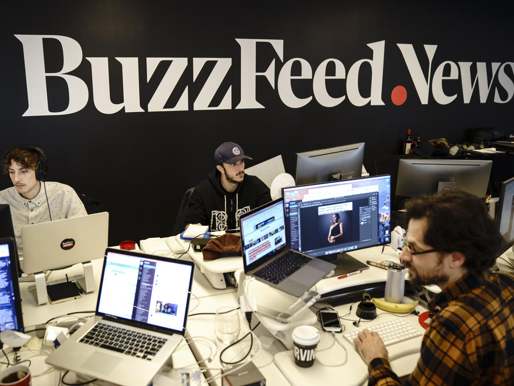 Members of the BuzzFeed News team work at their desks at BuzzFeed headquarters, December 11, 2018 in New York City.