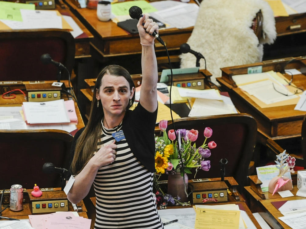 Montana state Rep. Zooey Zephyr, D-Missoula, stands in protest as demonstrators are arrested in the House gallery, on Monday, at the state Capitol in Helena, Mont.