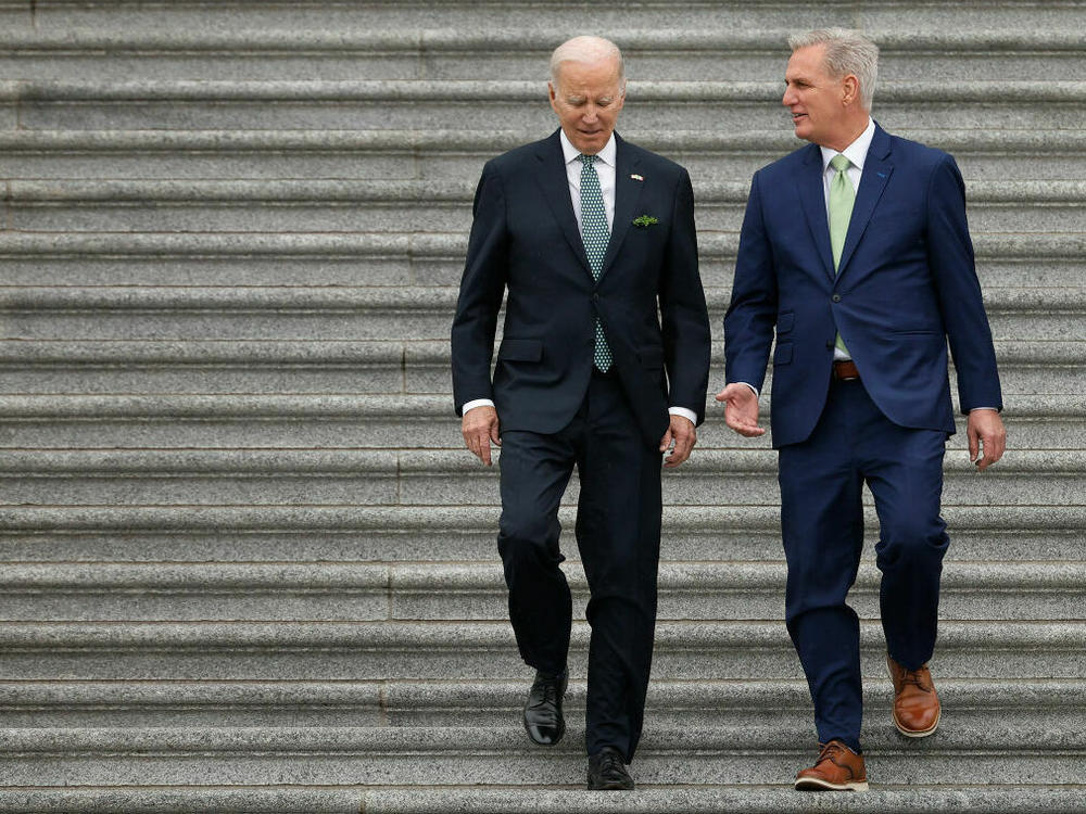 President Joe Biden and Speaker of the House Kevin McCarthy walk outside the U.S. Capitol at a Saint Patrick's Day event in March. The two haven't discussed the debt ceiling since February.