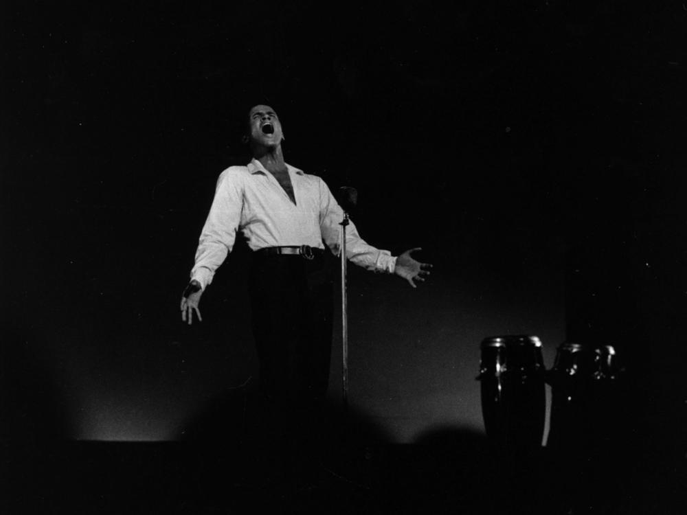 Calypso singer and actor Harry Belafonte performs in concert at London's Kilburn National Ballroom on Aug. 10 1958.