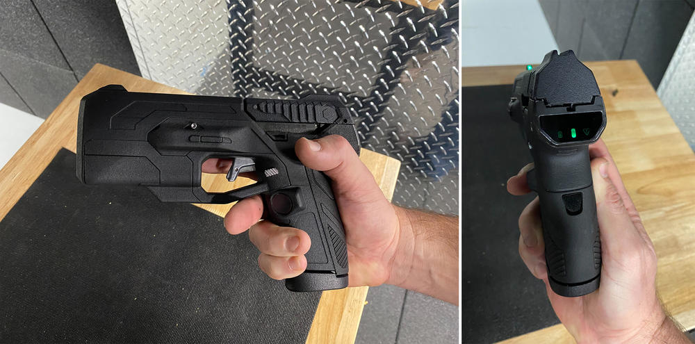 The version of the Biofire smart gun demonstrated for NPR. On the left, the fingerprint sensor can be seen on the gun grip. On the right, the facial recognition sensor can be seen on the back. The green lights indicate that the gun is unlocked.