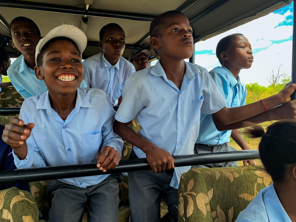 Sixth graders from Habu Primary School in Botswana on a safari. The trip is the high point of a multi-pronged effort by the nonprofit Wild Entrust to resolve a chronic conflict between rural villagers and the wild animals that destroy their crops.