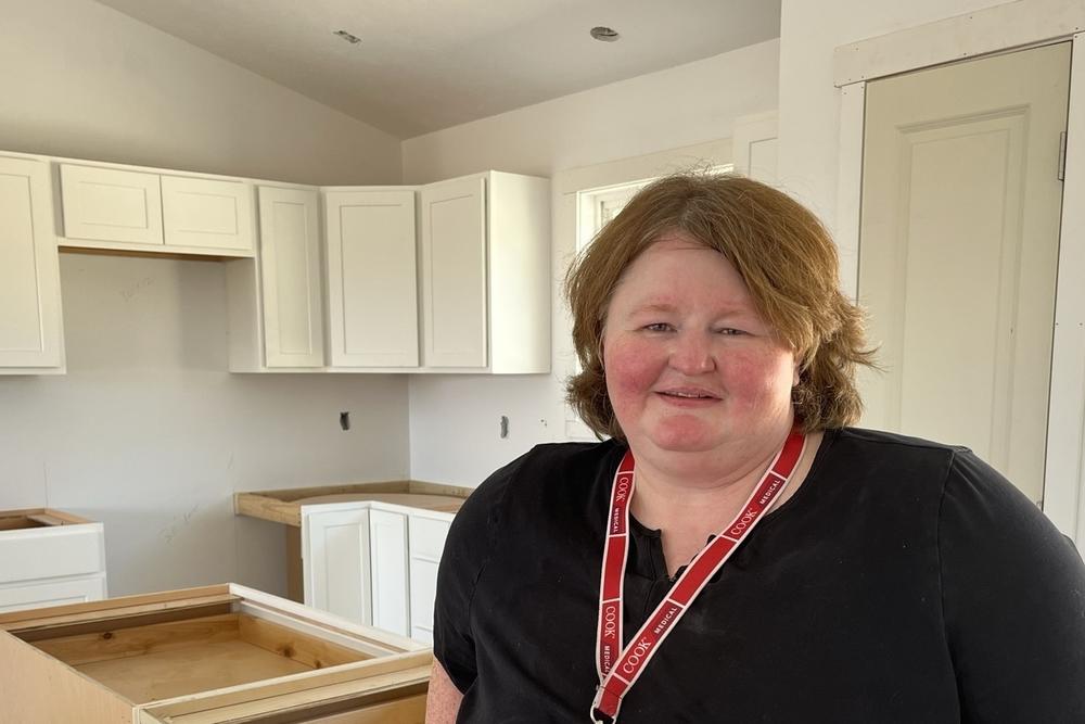 Tommie Jones visits the new home she's buying from her employer, Cook Medical. It will be the first time the 47-year-old quality control inspector has a place of her own.