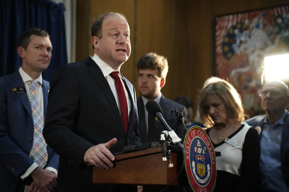 Colorado Gov. Jared Polis speaks before signing four gun control bills on Friday in the State Capitol in Denver.