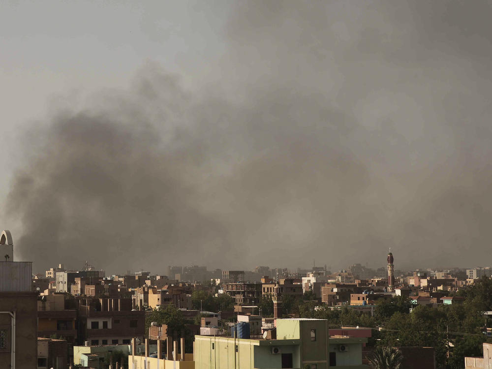 Smoke rises in Khartoum, Sudan, on Saturday, as gunfire and heavy artillery fire continued despite the extension of a ceasefire between the country's two top generals.