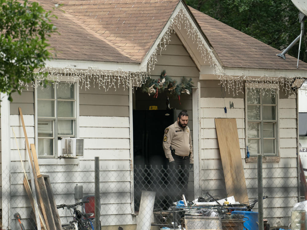 Law enforcement respond to a crime scene where five people, including an 8-year-old child, were killed after a shooting inside a home on Saturday in Cleveland, Texas.