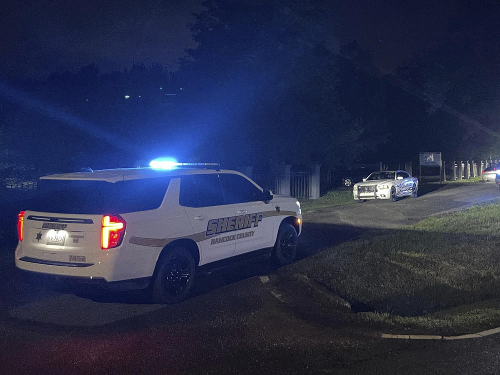 Bay St. Louis police, Hancock County sheriff's deputies and Waveland police respond to a shooting in Bay St. Louis, Miss., early Sunday morning.