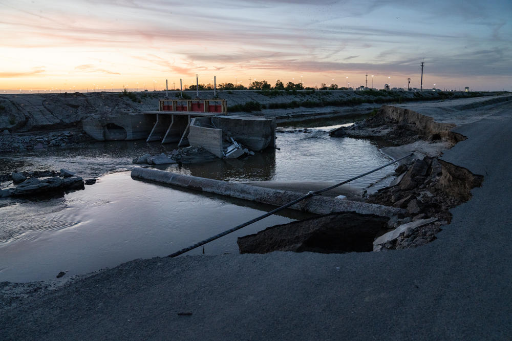 Part of a road has caved in from the flooding around Corcoran, Calif.