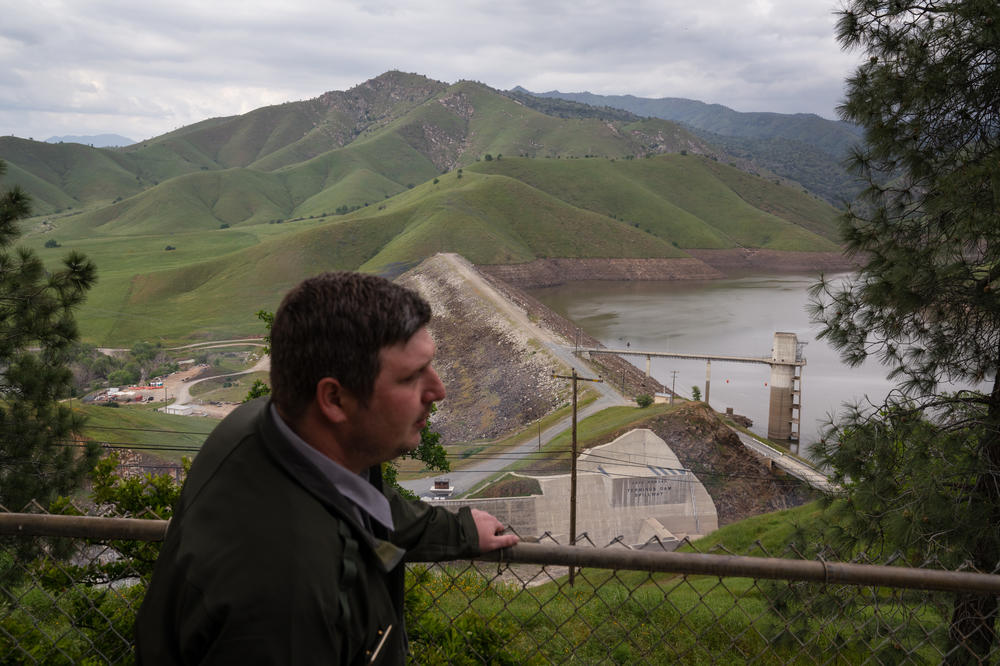 Ryan Watson, the U.S. Army Corps of Engineers' deputy operations project manager, stands above the Terminus Dam.