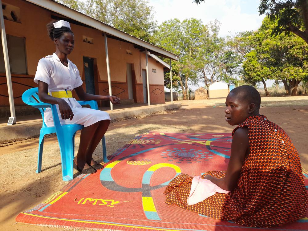 Aber Salume, a registered nurse at the Archbishop John Baptist Odama Care Center, works with a child who has nodding syndrome. Most of the children enrolled at the center are those with a severe form of the disease, she said: 