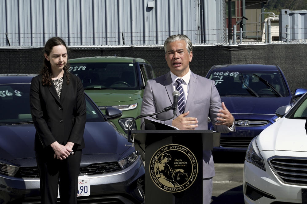 California Attorney General Rob Bonta, right, discusses the surge in thefts of Kia and Hyundai vehicles at a news conference on Thursday, April 20, 2023, in Berkeley, Calif.