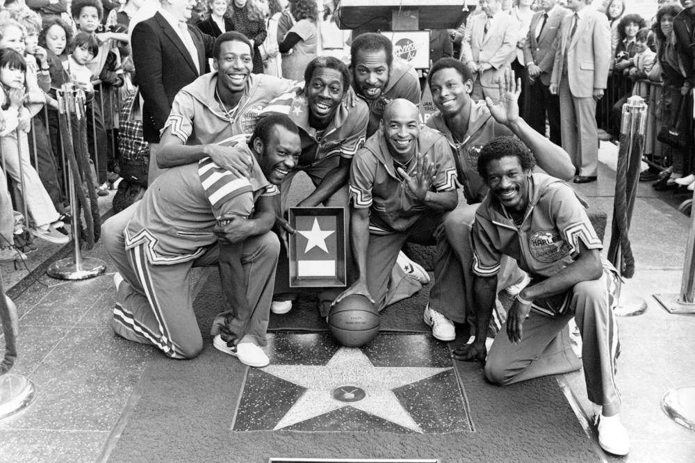 The Harlem Globetrotters are honored with a star in the Hollywood Walk of Fame in Los Angeles, on Jan. 19, 1982. The Globetrotters became the first athletic team to be honored with a star on the sidewalk. From left are, Billy Hobley, Dallas Thornton, Hubert 