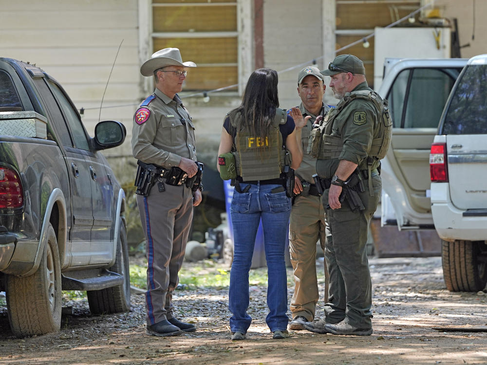 Law enforcement officials in the Cleveland, Texas, neighborhood where a man allegedly shot five of his neighbors after they asked him to stop firing off rounds in his yard.