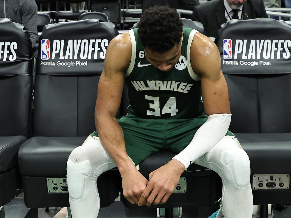 Giannis Antetokounmpo of the Milwaukee Bucks sits on the bench after losing Game 5 of the Eastern Conference First Round Playoffs against the Miami Heat in overtime.