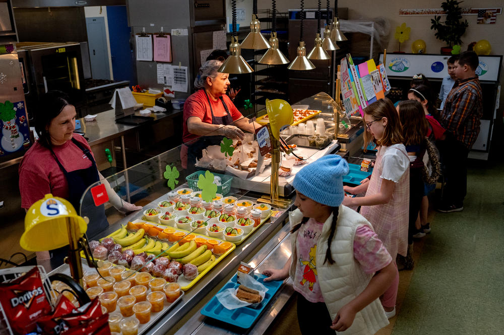 Oakville Elementary School students go through the lunch line on Wednesday, March 8, 2023, in Oakville, Mo.