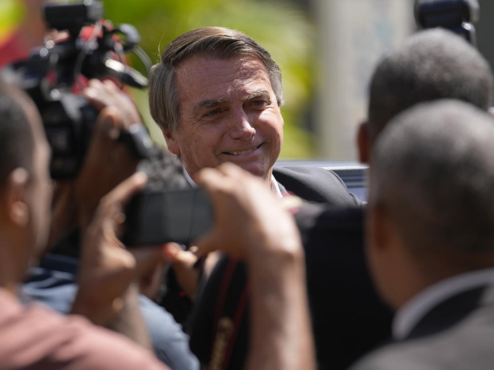 Former Brazilian President Jair Bolsonaro leaves Federal Police headquarters after giving testimony over the Jan. 8 attacks, in Brasilia, April 26.