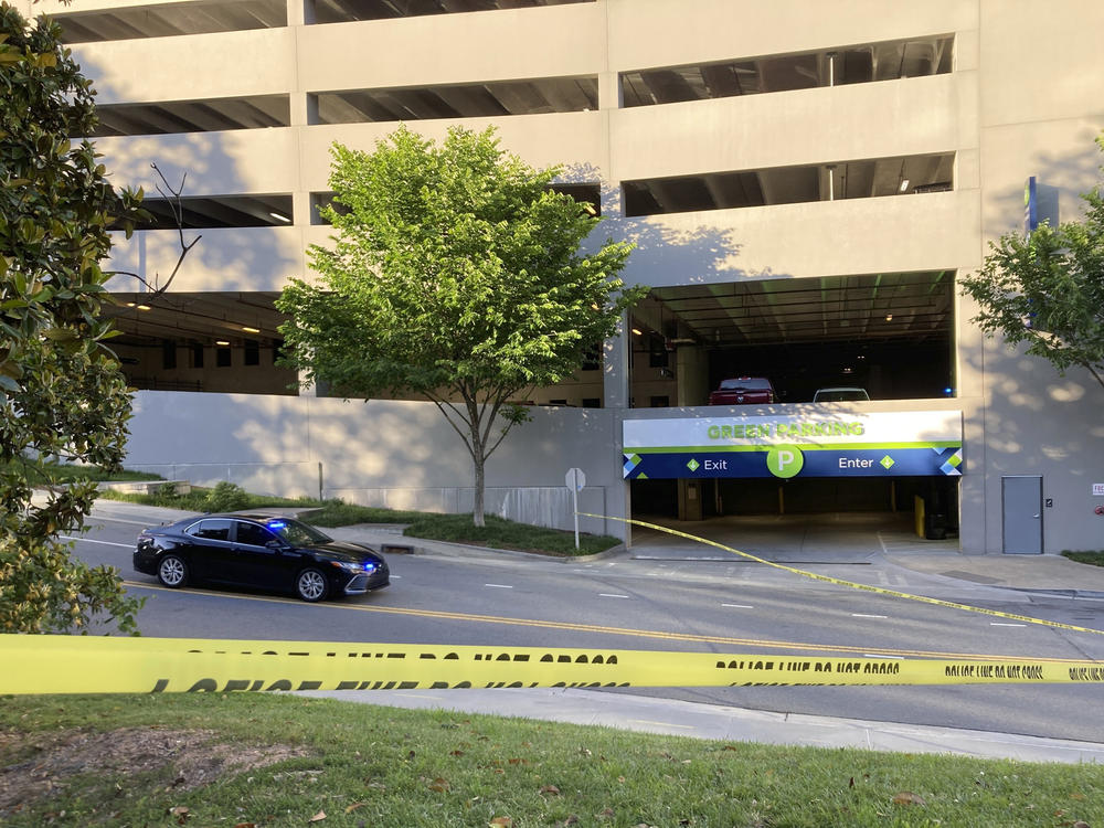 Authorities say a gunman who opened fire, Wednesday, May 3, 2023, at an Atlanta medical facility, killing one, stole a vehicle shortly after the shooting in order to flee from police. The vehicle was later found at a Cobb County parking garage, pictured here on Monday, that is part of the Battery, a mixed-use development near the stadium where the Atlanta Braves play.