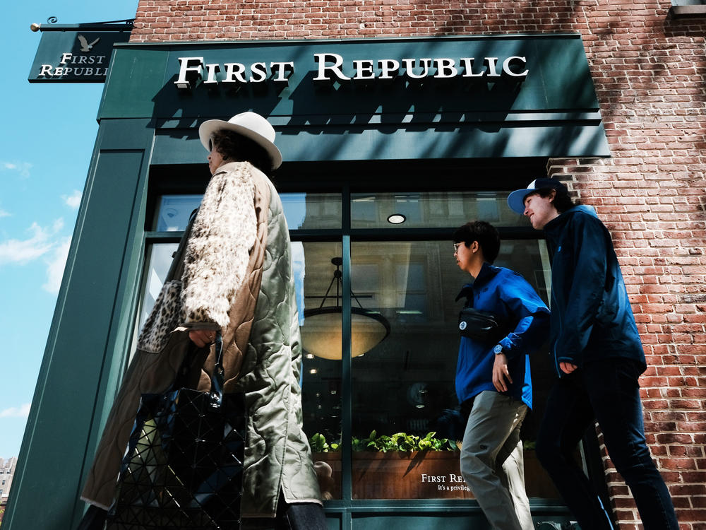 A person walks past a First Republic bank branch in Manhattan, New York City, on April 24, 2023. The lender was sold to JPMorgan Chase on Monday after a brief government takeover, becoming the third bank to fail this year.