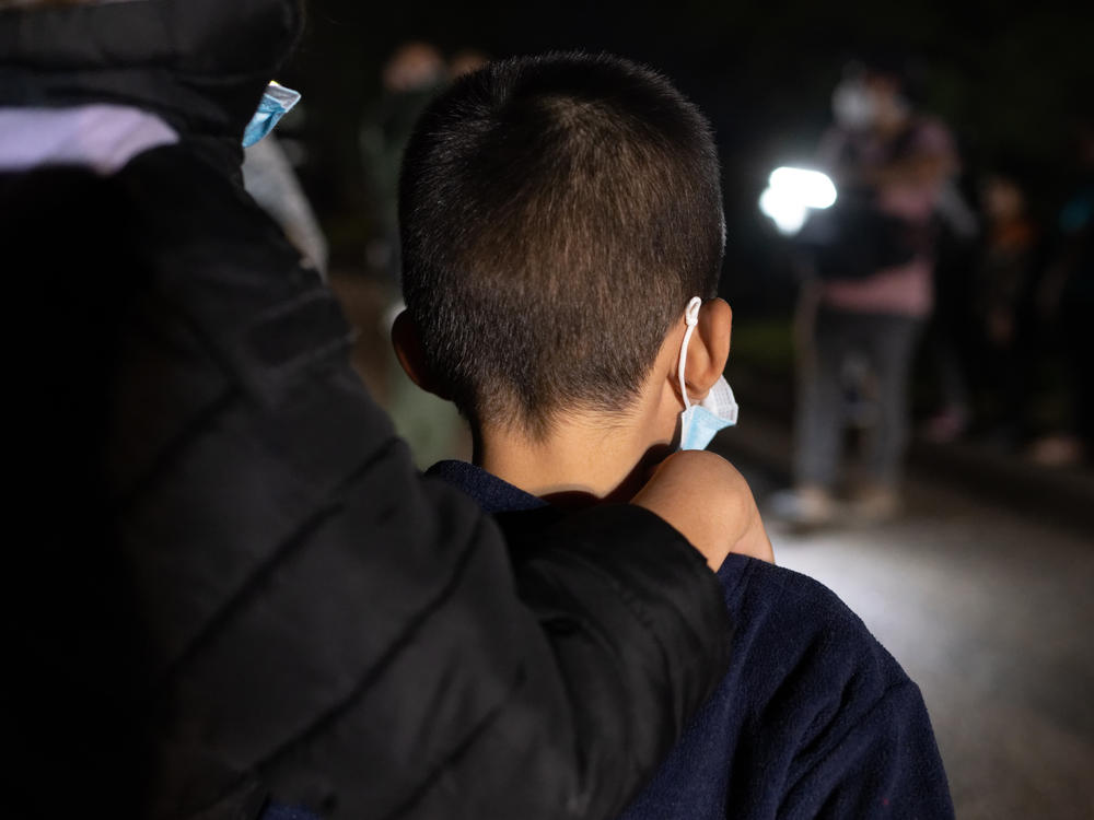 Unaccompanied immigrant minors wait to be processed by Border Patrol agents after they crossed the Rio Grande into south Texas on April 29, 2021.