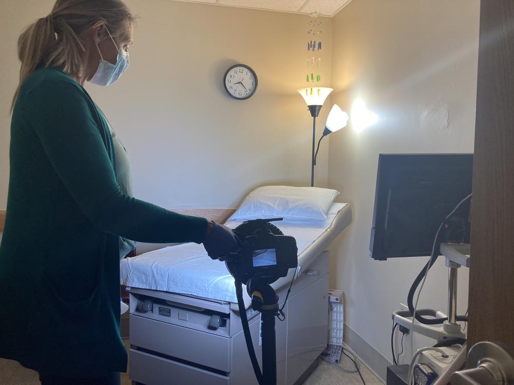 After a patient leaves, Jacqueline Towarnicki prepares the examination room in case she gets a call that someone else needs to see a sexual assault nurse examiner.