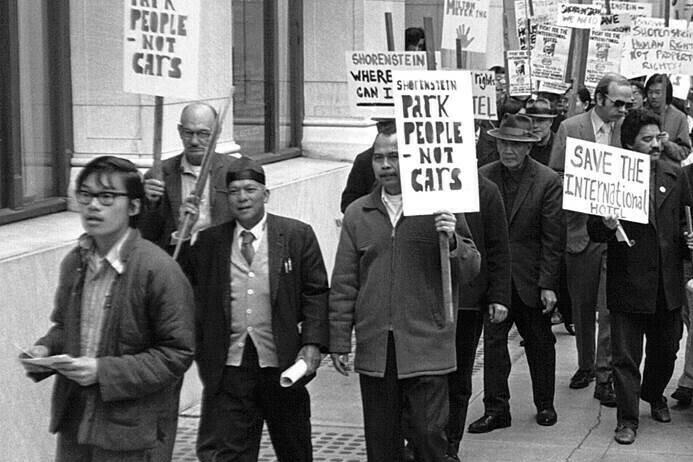 Harvey (pictured at the front) takes part in a march for low-cost housing in the early 1970s.