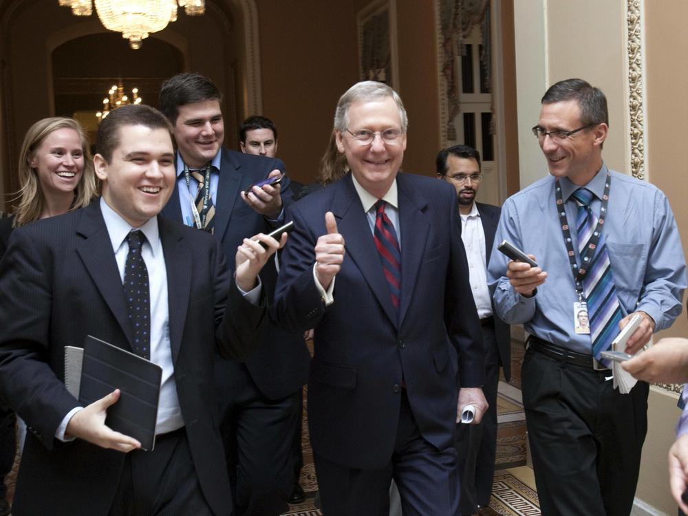 Senate Minority Leader Mitch McConnell, R-Ky., is all smiles as he walks to the Senate floor to announce that a deal has been reached on the debt ceiling on Capitol Hill in Washington on July 31, 2011.