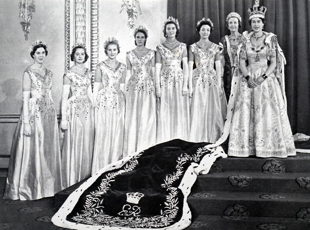 Queen Elizabeth II poses with her Mistress of the Robes and the six Maids of Honour after her coronation.
