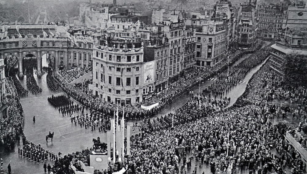 Crowds in central London celebrate during the coronation of Queen Elizabeth II.