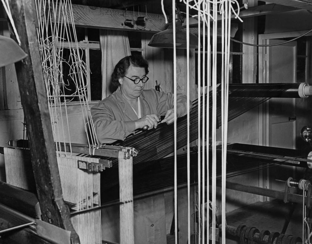 Lilly Lee, a weaver at Warner & Sons, Braintree, Essex, hand weaves the velvet that will go to make the coronation robes for Queen Elizabeth II, Nov. 18, 1952.