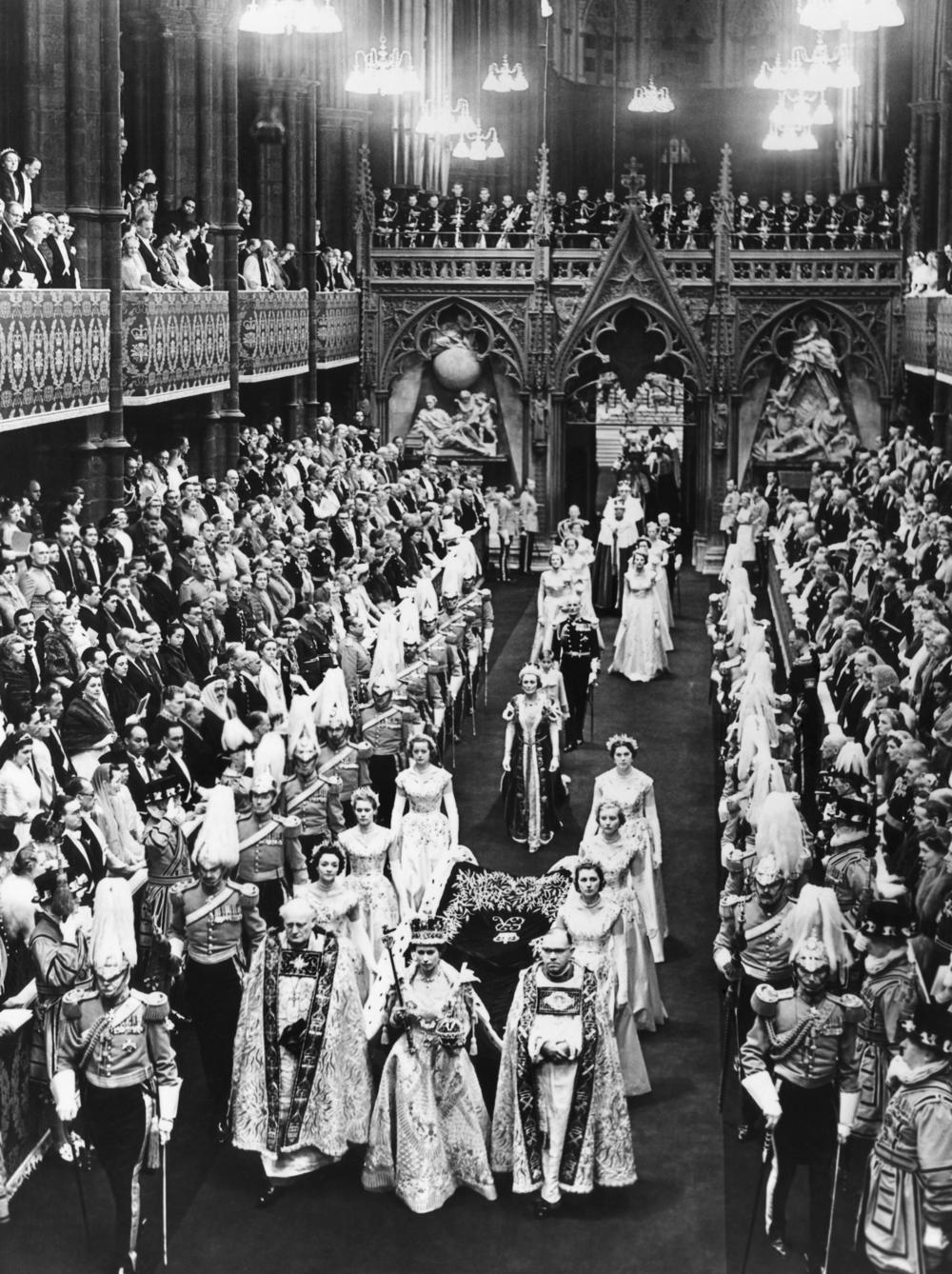 Queen Elizabeth II walks down the aisle at Westminster Abbey, on her coronation day.
