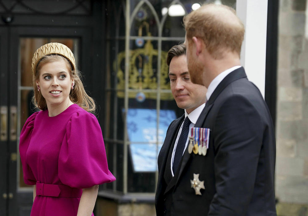 Britain's Prince Harry, Princess Beatrice and Edoardo Mapelli Mozzi arrive at Westminster Abbey ahead of the coronation of King Charles III and Camilla, the Queen Consort, in London.
