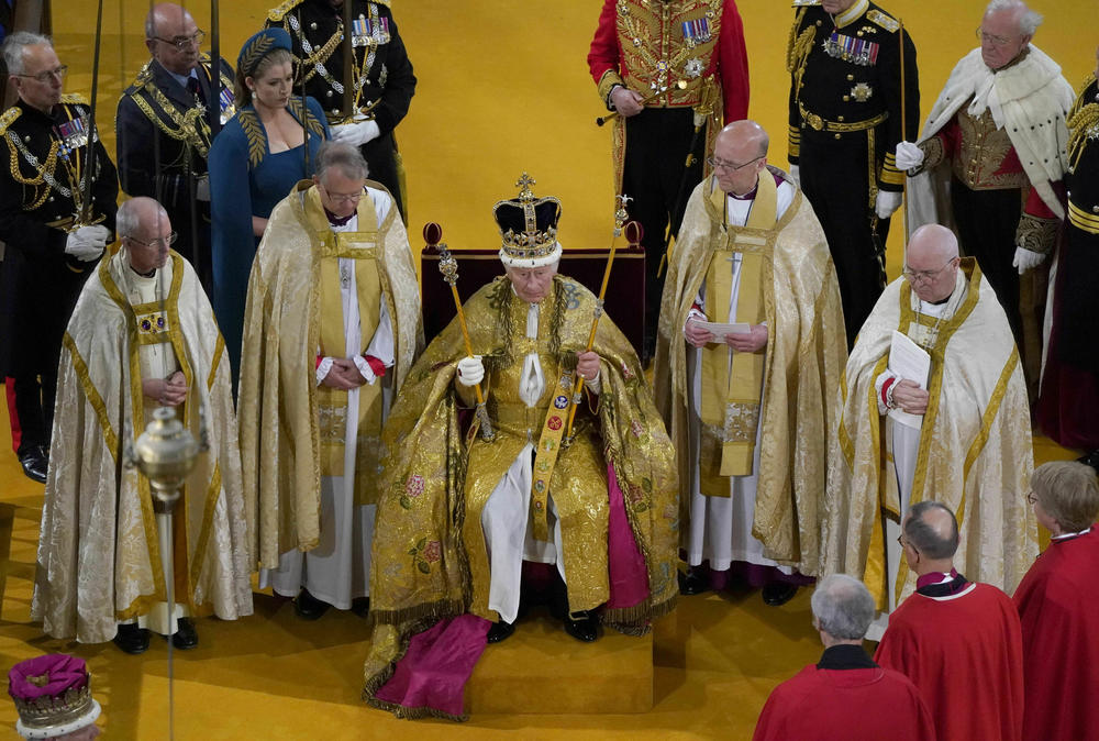 Britain's King Charles III receives The St Edward's Crown during his coronation ceremony at Westminster Abbey.