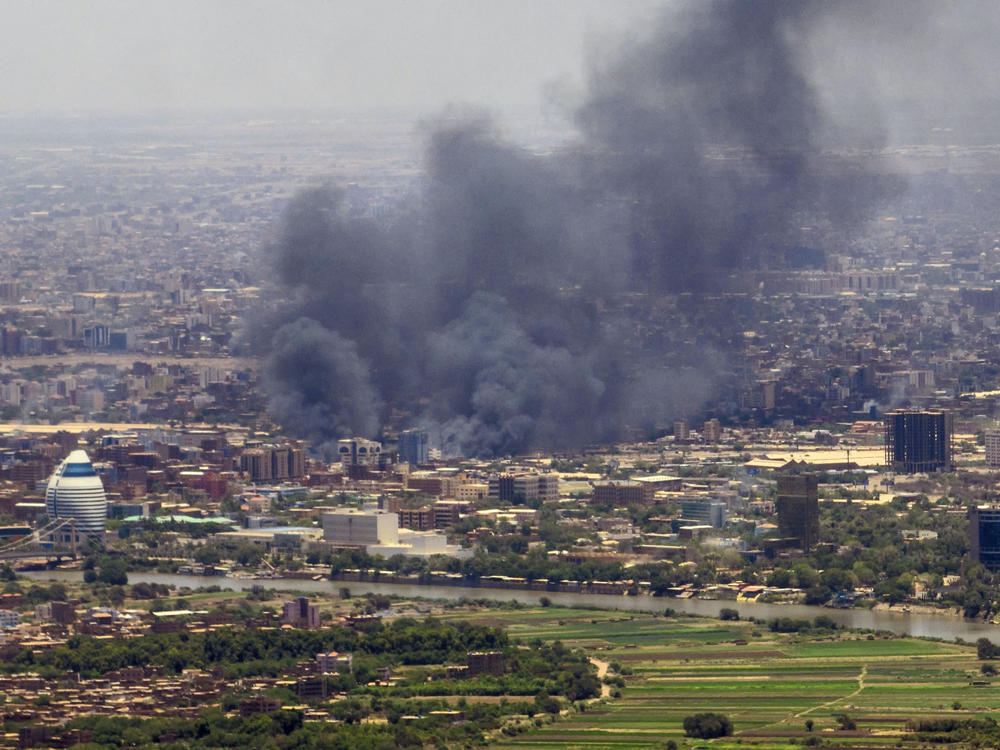 Smoke billows during fighting in the Sudanese capital Khartoum on Wednesday. Hundreds have been killed and thousands injured in the fighting.