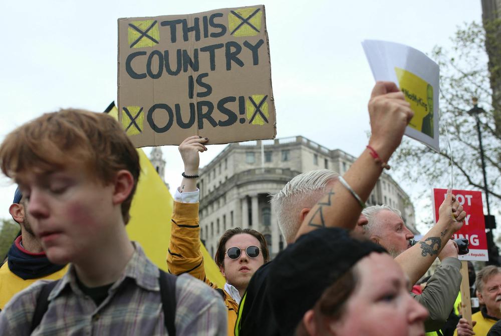 Protesters hold up placards saying 'Not My King' in Trafalgar Square close to where Britain's King Charles III and Britain's Camilla, Queen Consort will be crowned .