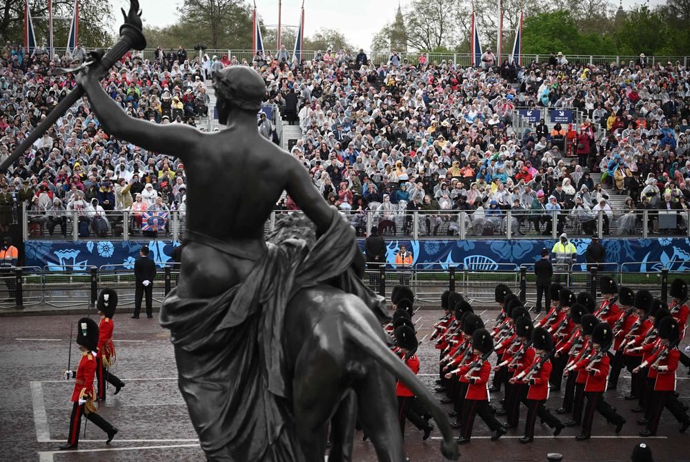 Members of the Household Division Foots Guards march on the route of the 'King's Procession', a journey of two kilometres from Buckingham Palace to Westminster Abbey in central London.