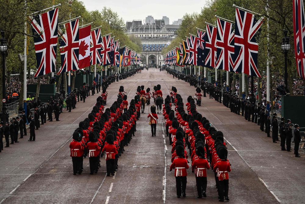 Members of the Coldstream Guards march on the route of the 'King's Procession', a journey of two kilometres from Buckingham Palace to Westminster Abbey.