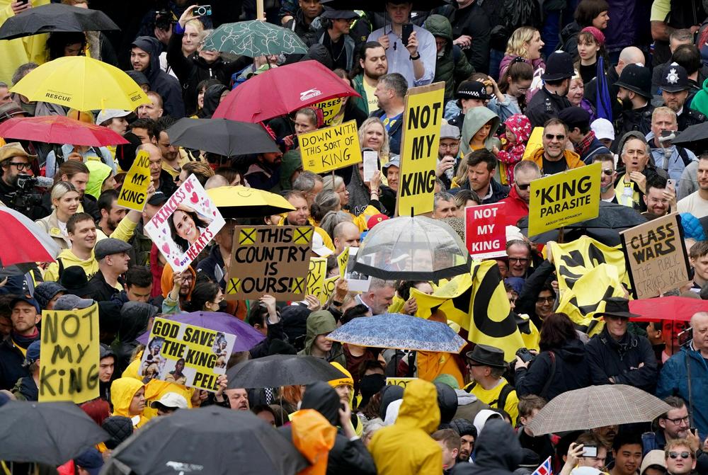 Protesters hold up placards saying 'Not My King' in Trafalgar Square close to where Britain's King Charles III and Britain's Camilla, Queen Consort will be crowned at Westminster Abbey.