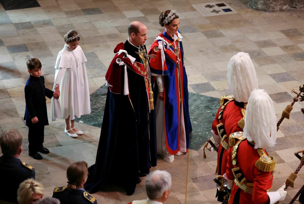 Britain's Prince William, Prince of Wales, Britain's Catherine, Princess of Wales, Britain's Princess Charlotte of Wales and Britain's Prince Louis of Wales arrive at Westminster Abbey.