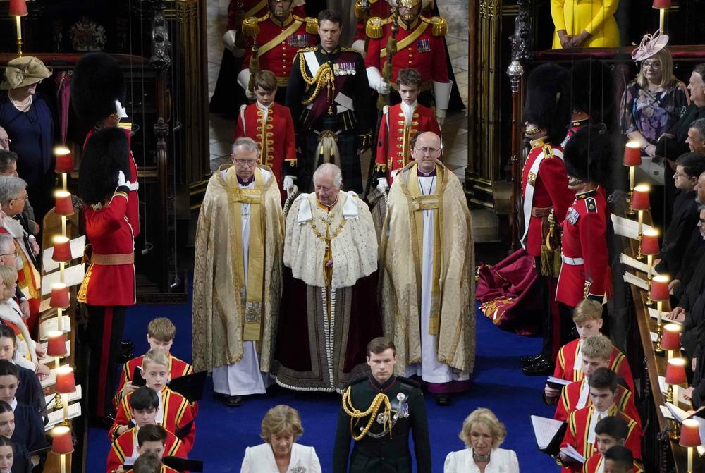 King Charles III arrives for his coronation, followed by Prince George, at Westminster Abbey.