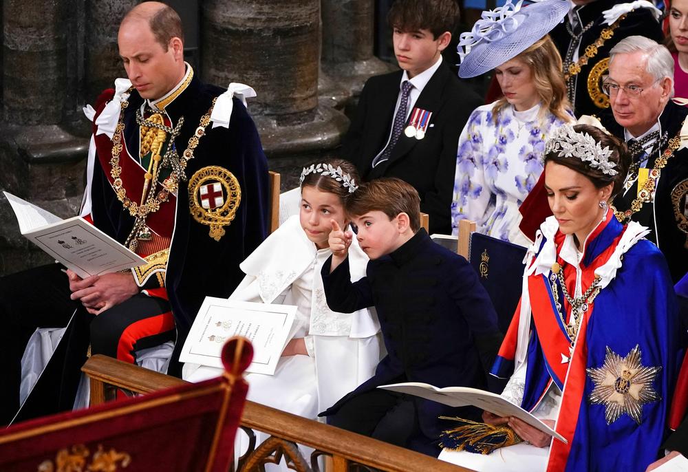 (from left to right) Britain's Prince William, Prince of Wales, Princess Charlotte, Prince Louis and Britain's Catherine, Princess of Wales attend the coronations of Britain's King Charles III and Britain's Camilla, Queen Consort at Westminster Abbey.