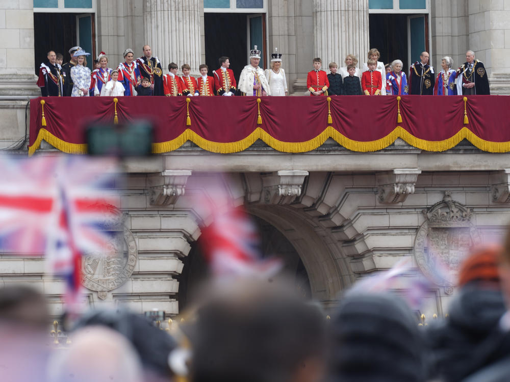 Royals gather on the balcony of Buckingham Palace to view a flypast by aircraft from the Royal Navy, Army Air Corps and Royal Air Force following the coronation of King Charles III and Queen Camilla on Saturday in London.