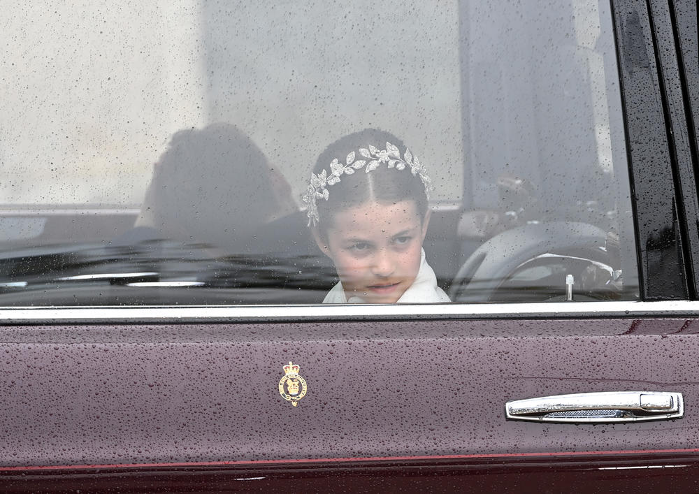 Princess Charlotte of Wales travelling in the state car during the coronation.