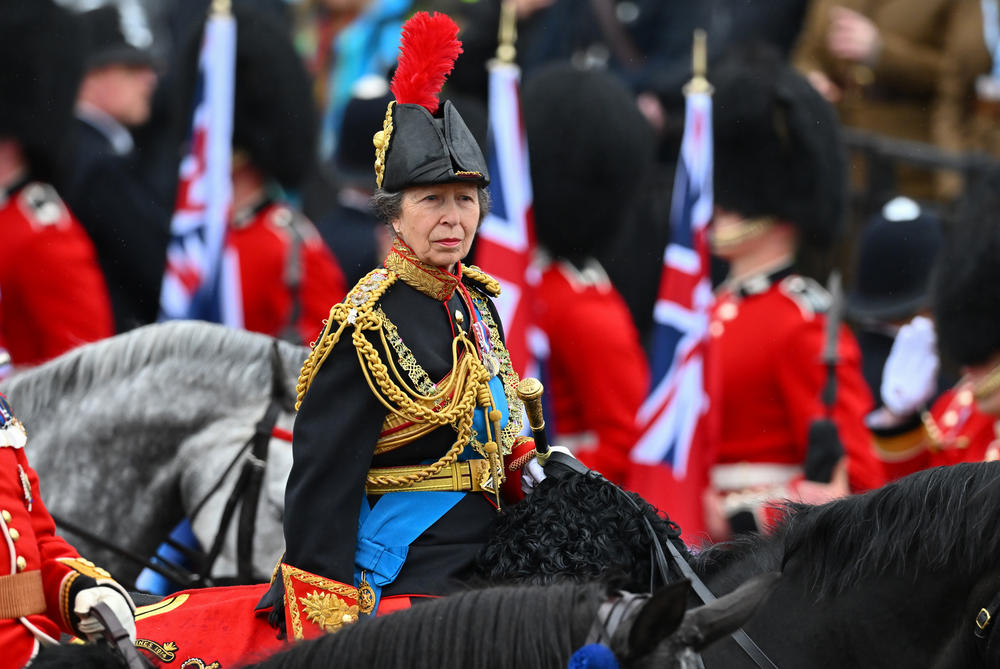 Princess Anne, Princess Royal rides on horseback behind the gold state coach carrying the newly crowned King and Queen Consort as they travel down The Mall.