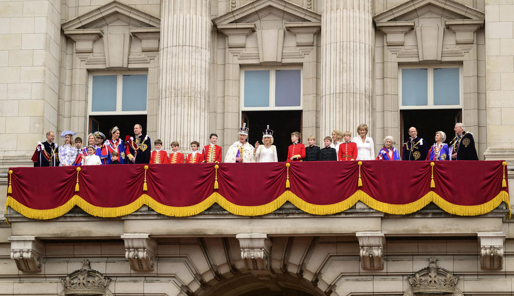 King Charles III and Queen Camilla, centre, wave from the balcony of Buckingham Palace with the rest of the Royal family after their coronation.