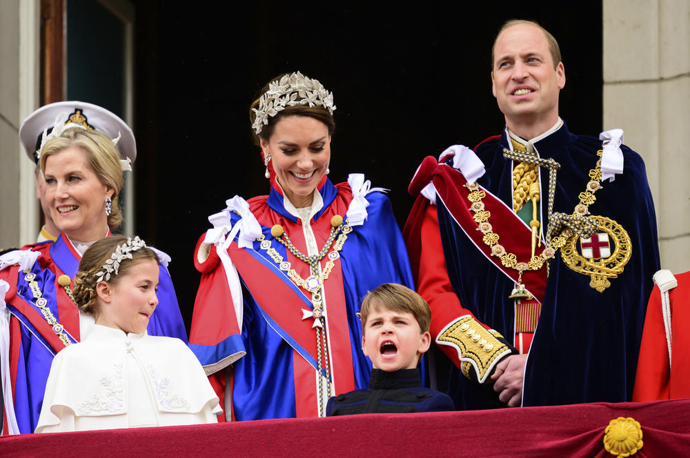 Sophie, Duchess of Edinburgh, left, Kate, Princess of Wales, centre, Prince William, right, stand on the balcony of Buckingham Palace with Princess Charlotte, down left, and Prince Louis, down center, after the coronation of Britain's King Charles III.
