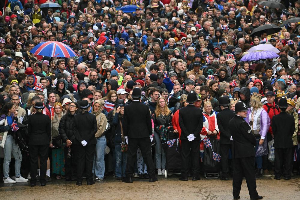 Crowds prepare to fill The Mall as they wait for members of the Royal Family to appear on the Buckingham Palace balcony.