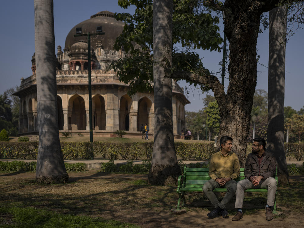 Utkarsh Saxena (left) and Ananya Kotia chat in a public park in New Delhi in January. They are among the LGBTQ+ couples who have filed a petition to India's Supreme Court that seeks the legalization of same-sex marriage.