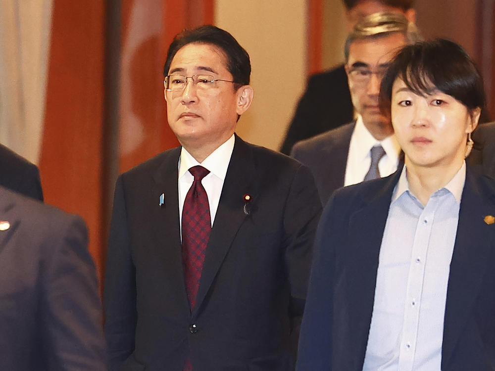 Japanese Prime Minister Fumio Kishida, center, leaves after meeting with business leaders at a hotel in Seoul, South Korea, Monday, May 8, 2023.