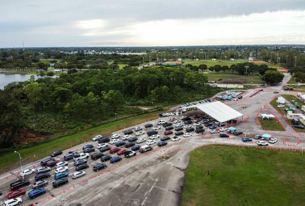 Cars line up at a COVID-19 testing site at Tropical Park in Miami, Fla., on Dec. 21, 2021, during the omicron surge. Thanks to the public health emergency, COVID testing was free during the major surges of the pandemic.